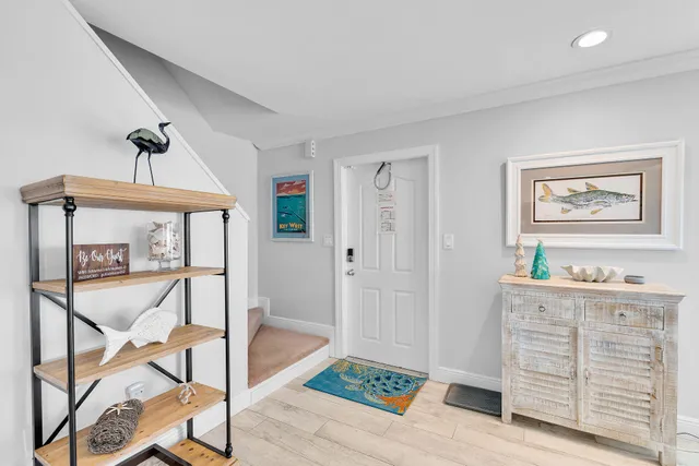 a view of room with window and hallway