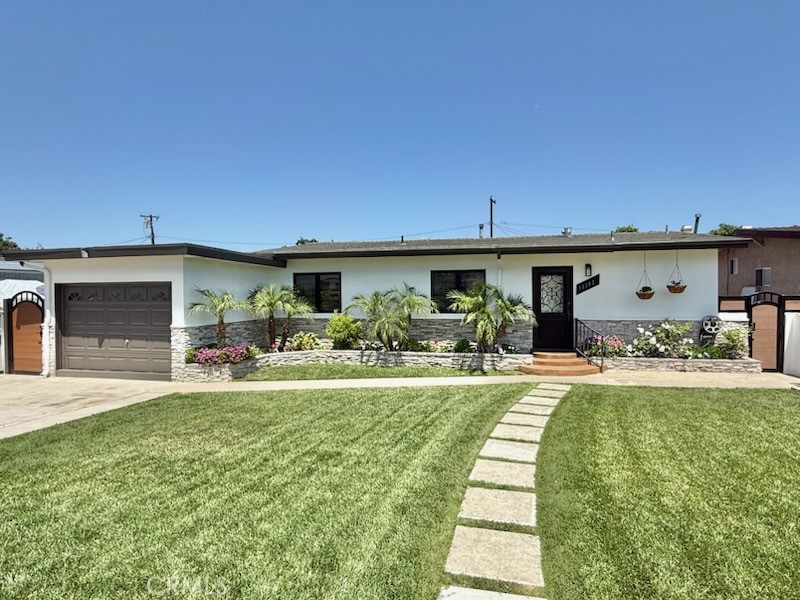 13302 Sandra Place Garden Grove, CA 92843 - Photo 1 of 41 a view of a house with backyard porch and sitting area