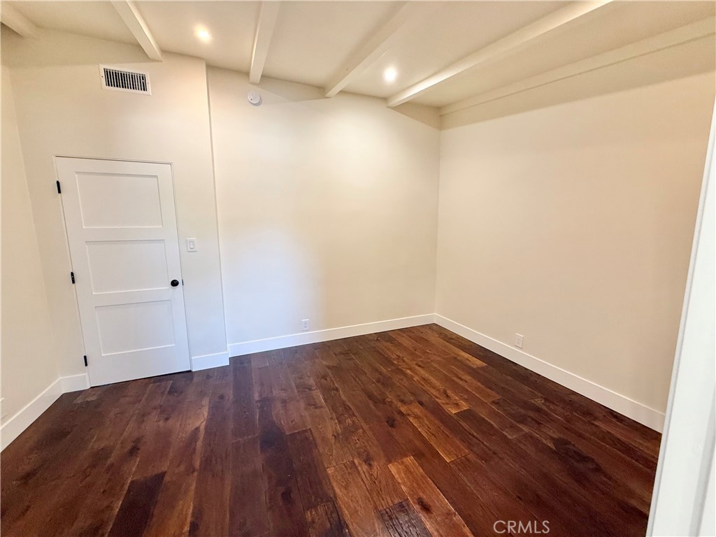 13302 Sandra Place Garden Grove, CA 92843 - Photo 23 of 41 a view of empty room with wooden floor