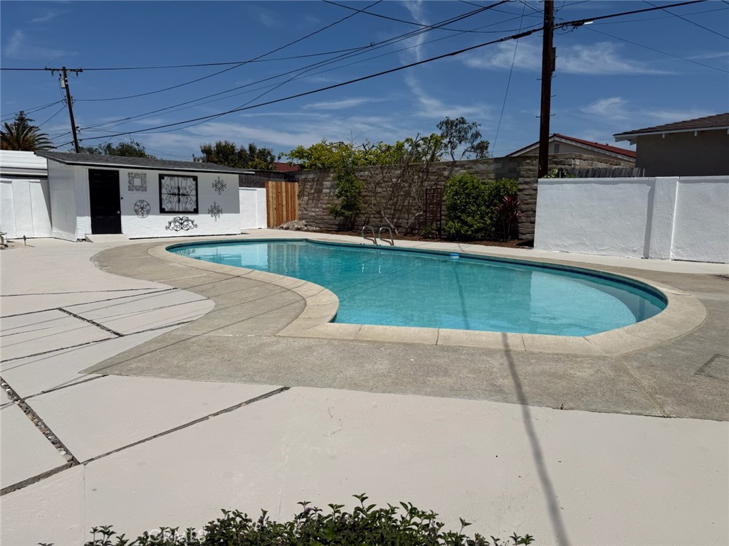 13302 Sandra Place Garden Grove, CA 92843 - Photo 27 of 41 a swimming pool with outdoor seating