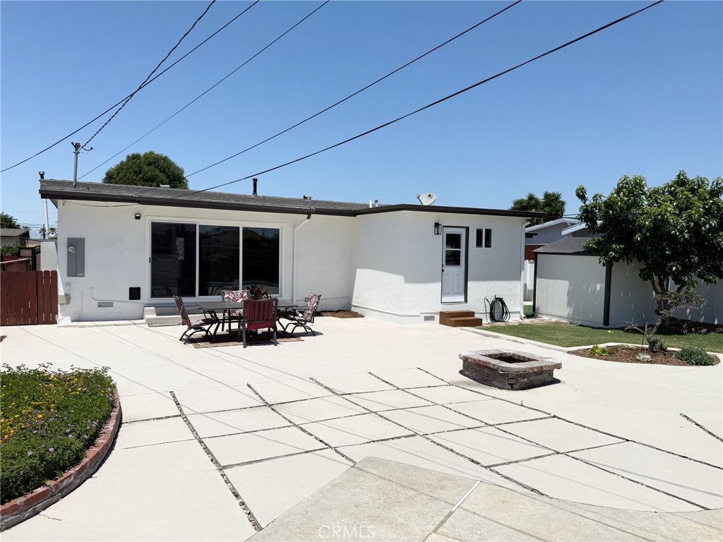 13302 Sandra Place Garden Grove, CA 92843 - Photo 31 of 41 a view of a house with backyard and sitting area