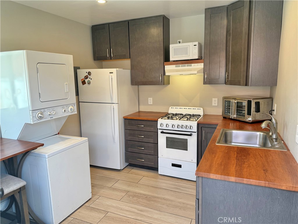 13302 Sandra Place Garden Grove, CA 92843 - Photo 37 of 41 a kitchen with a refrigerator and a stove