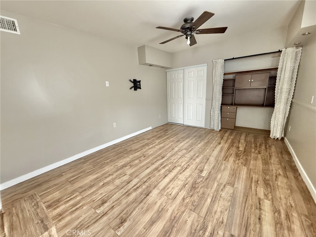 13302 Sandra Place Garden Grove, CA 92843 - Photo 38 of 41 a view of empty room with wooden floor and fan