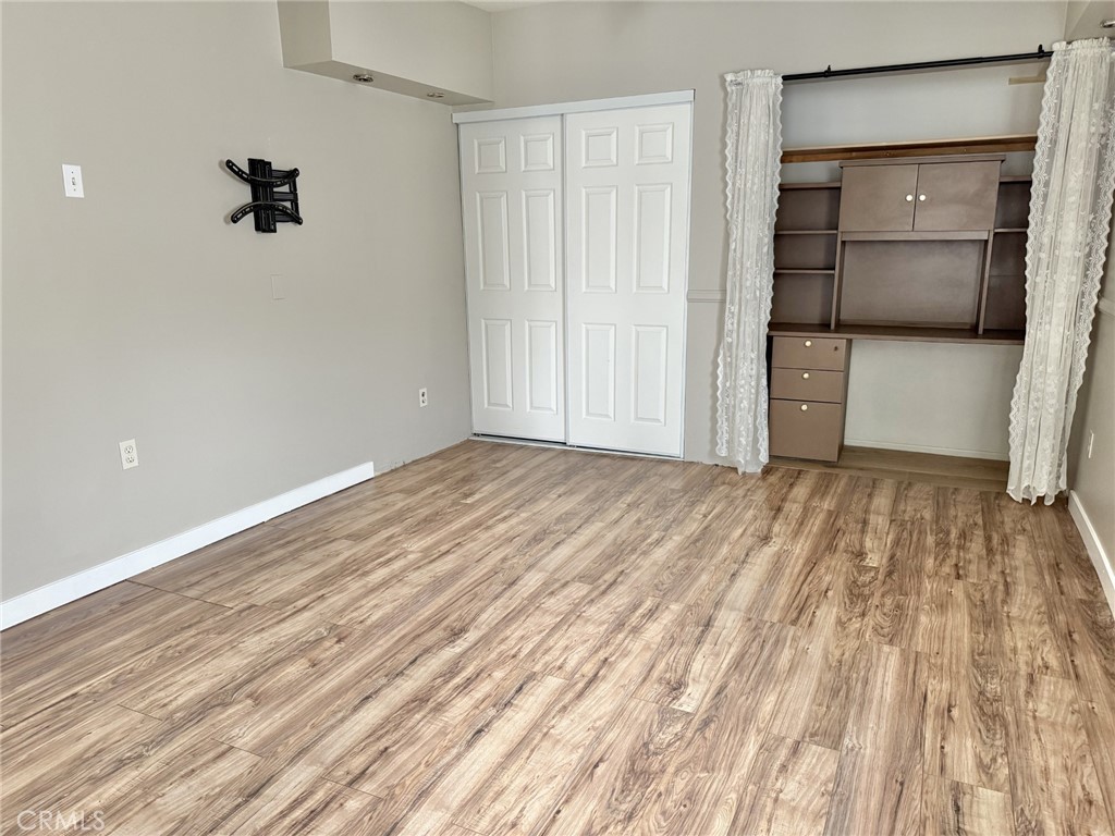 13302 Sandra Place Garden Grove, CA 92843 - Photo 39 of 41 a view of empty room with wooden floor