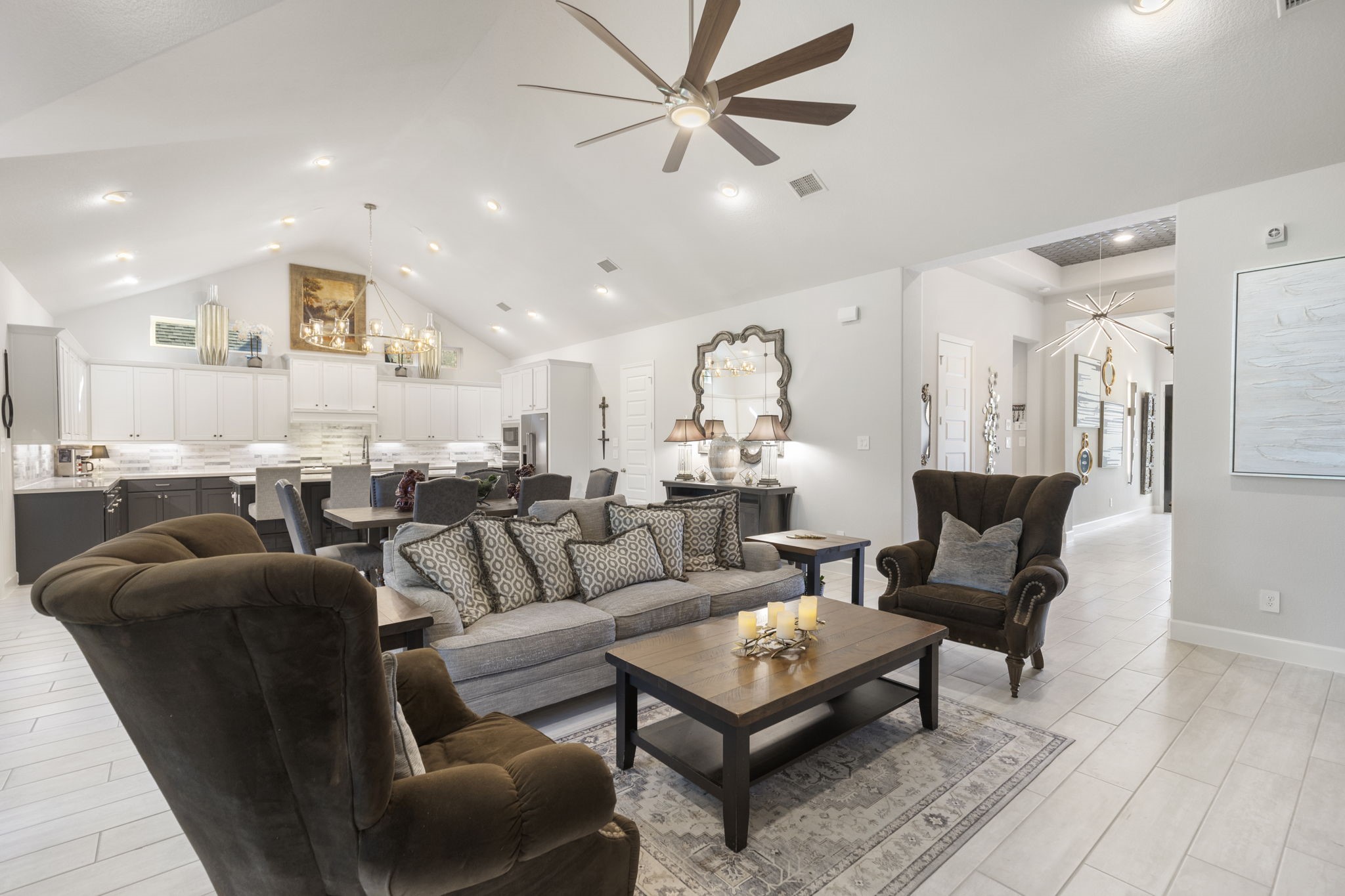 15423 Ringbill Way Magnolia, TX 77354 - Photo 13 of 50 a living room with furniture a rug and a chandelier