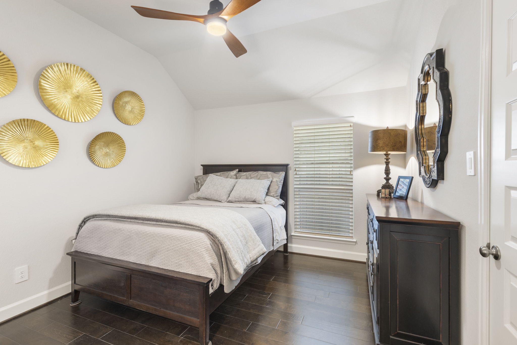 15423 Ringbill Way Magnolia, TX 77354 - Photo 35 of 50 a bedroom with a bed and a chandelier