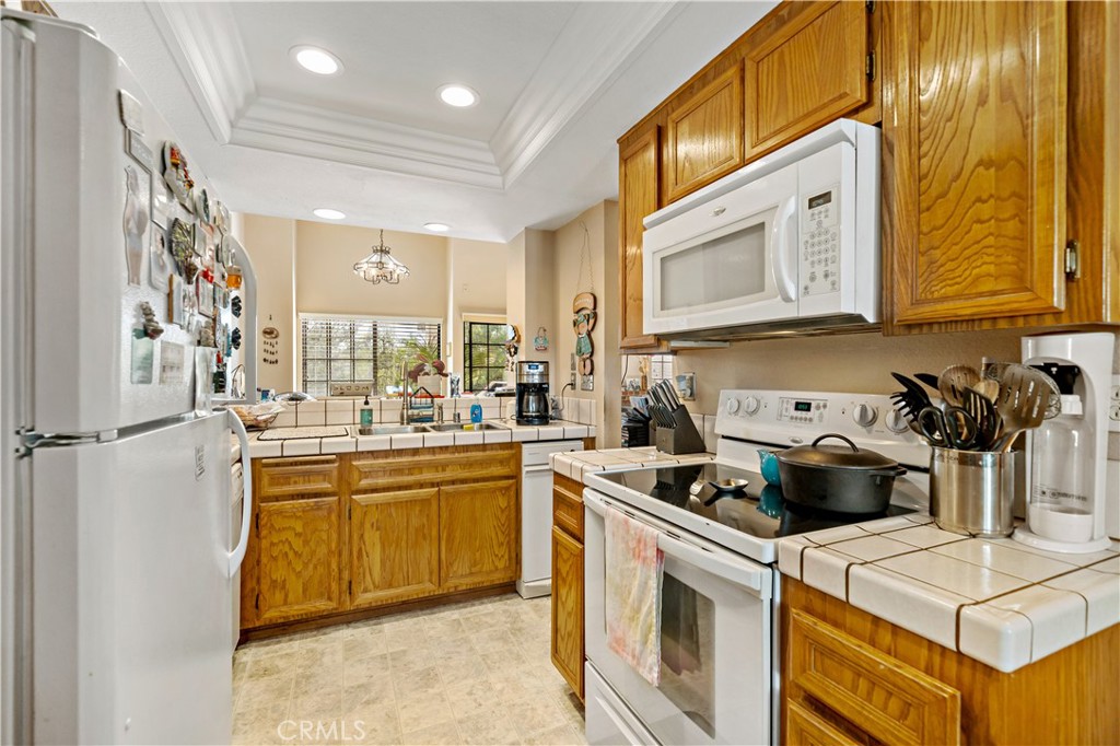 1514 Apache Drive, Unit E Chula Vista, CA 91910 - Photo 16 of 43 a kitchen with a stove and a sink