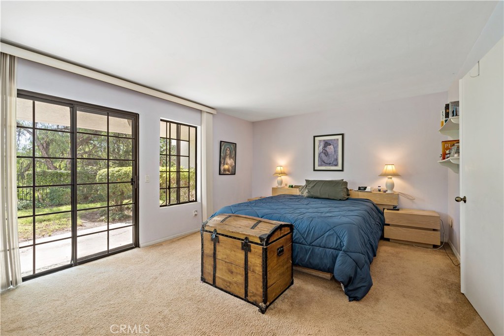 1514 Apache Drive, Unit E Chula Vista, CA 91910 - Photo 29 of 43 a bedroom with a bed and a large window