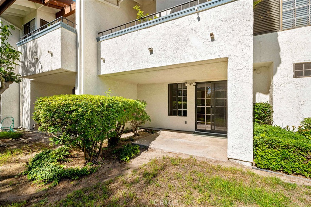 1514 Apache Drive, Unit E Chula Vista, CA 91910 - Photo 32 of 43 a front view of a house with a yard
