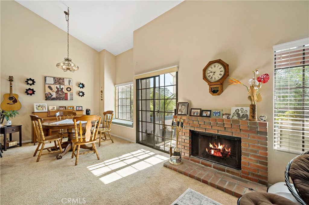 1514 Apache Drive, Unit E Chula Vista, CA 91910 - Photo 9 of 43 a living room with furniture a clock and a fireplace