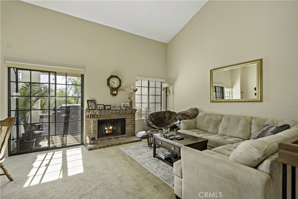 1514 Apache Drive, Unit E Chula Vista, CA 91910 - Photo 10 of 43 a living room with furniture and a fireplace
