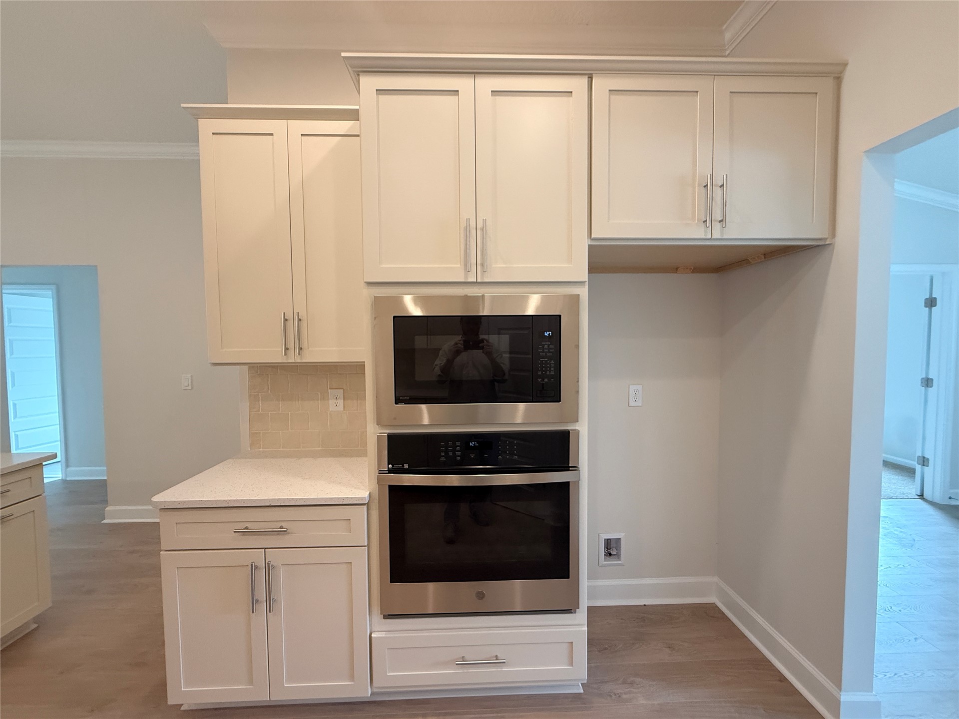 941842 Old Nassauville Road Fernandina Beach, FL 32034 - Photo 8 of 14 a kitchen with granite countertop white cabinets and stainless steel appliances