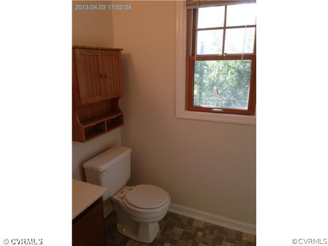 5302 Ridgerun Court Chesterfield, VA 23832 - Photo 11 of 14 a white toilet sitting next to a window