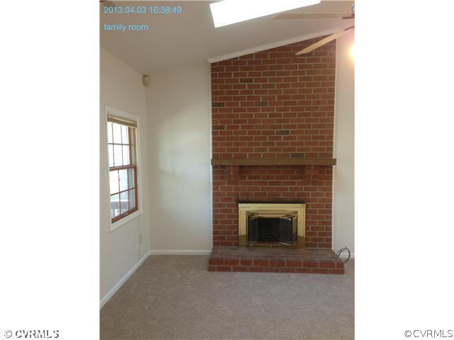 5302 Ridgerun Court Chesterfield, VA 23832 - Photo 3 of 14 a view of an empty room with a fireplace and a window