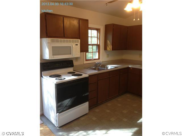 5302 Ridgerun Court Chesterfield, VA 23832 - Photo 5 of 14 a kitchen with a stove and a microwave