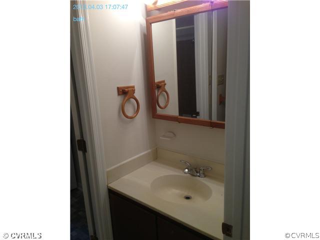 5302 Ridgerun Court Chesterfield, VA 23832 - Photo 9 of 14 a bathroom with a sink and mirror
