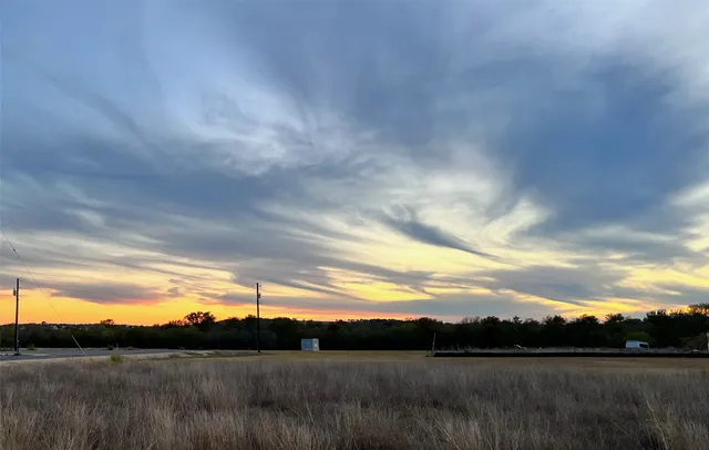 a view of sunset and yard