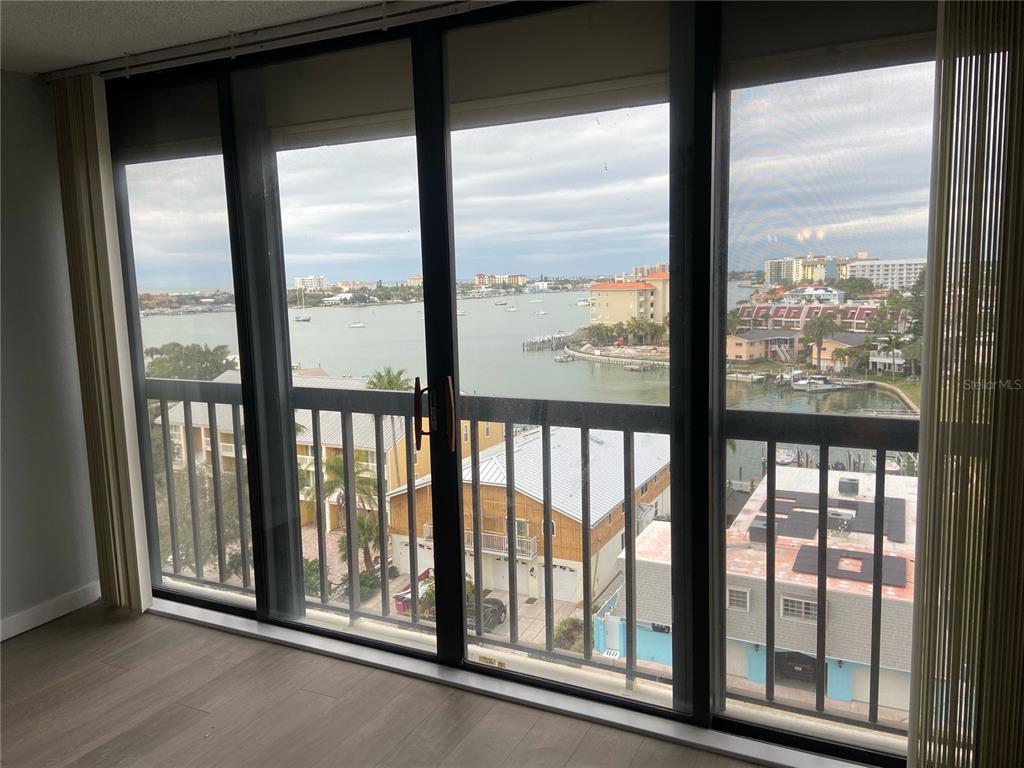 255 Dolphin Point, Unit 809 Clearwater, FL 33767 - Photo 16 of 42 a view of an empty room with balcony