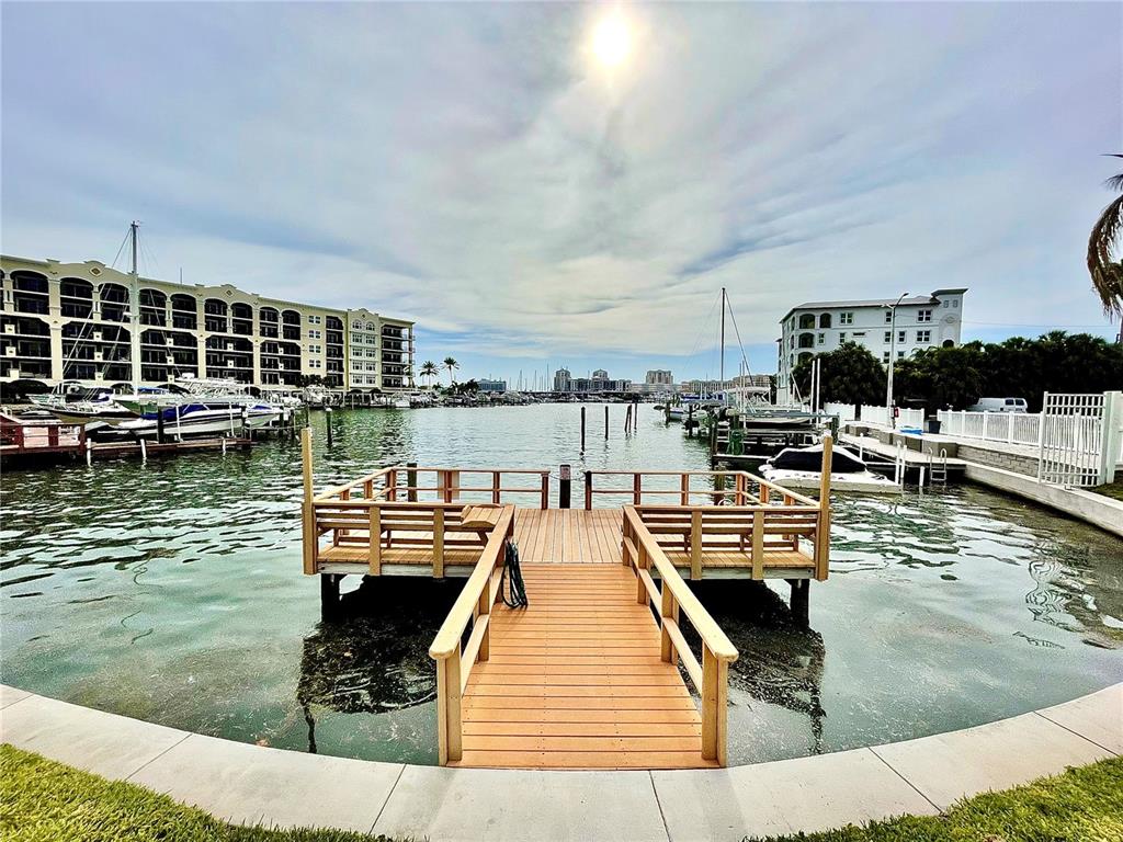255 Dolphin Point, Unit 809 Clearwater, FL 33767 - Photo 20 of 42 a view of a lake with outdoor seating