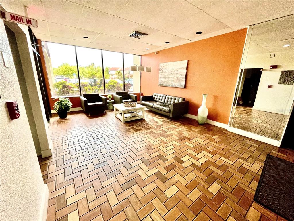 255 Dolphin Point, Unit 809 Clearwater, FL 33767 - Photo 21 of 42 a bedroom with double vanity and a large window