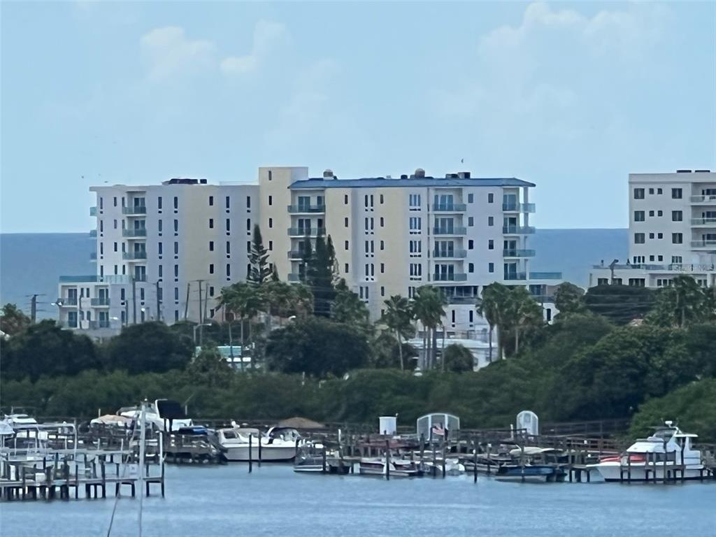 255 Dolphin Point, Unit 809 Clearwater, FL 33767 - Photo 32 of 42 a view of a lake with building in the background