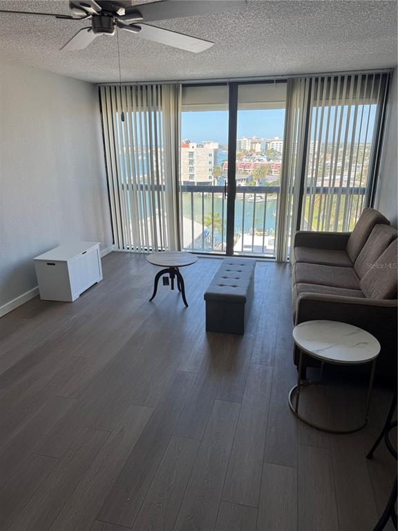 255 Dolphin Point, Unit 809 Clearwater, FL 33767 - Photo 40 of 42 a living room with furniture and a large window