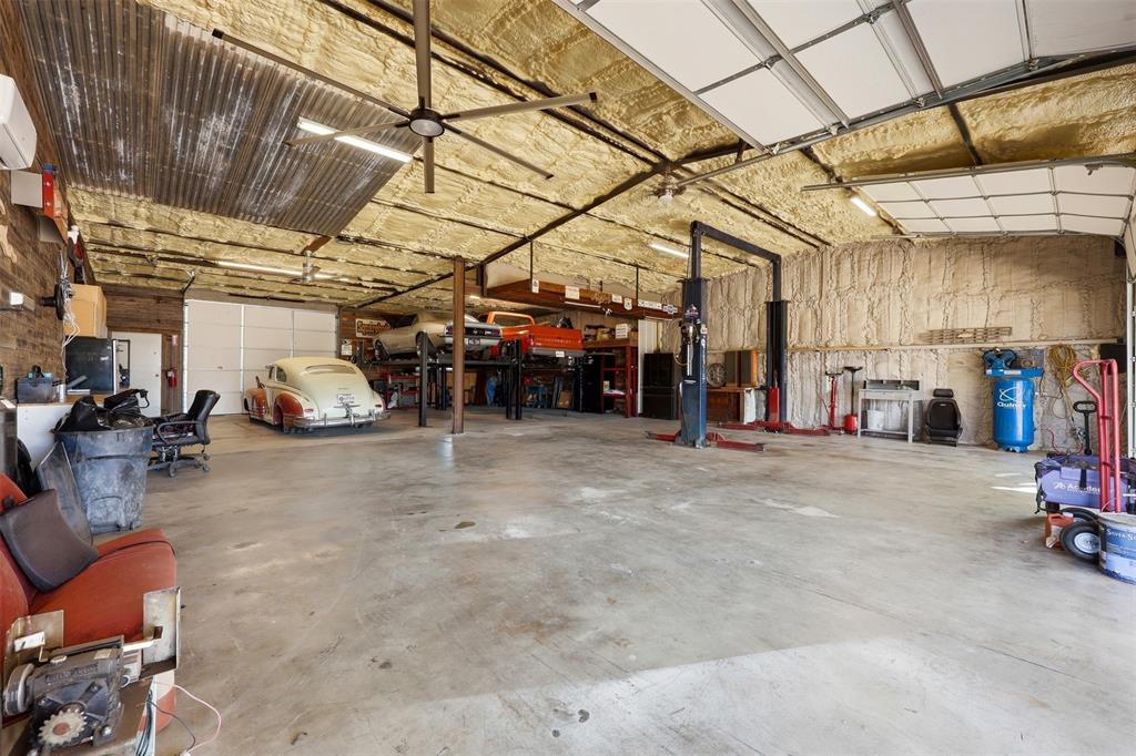 113 Mulkey Road Waxahachie, TX 75167 - Photo 22 of 39 a view of a garage with storage