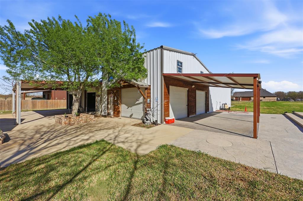 113 Mulkey Road Waxahachie, TX 75167 - Photo 26 of 39 a front view of a house with a yard and garage