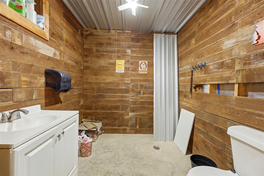 113 Mulkey Road Waxahachie, TX 75167 - Photo 29 of 39 a bathroom with a sink and a mirror