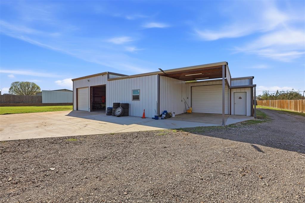 113 Mulkey Road Waxahachie, TX 75167 - Photo 31 of 39 a view of a house with a yard