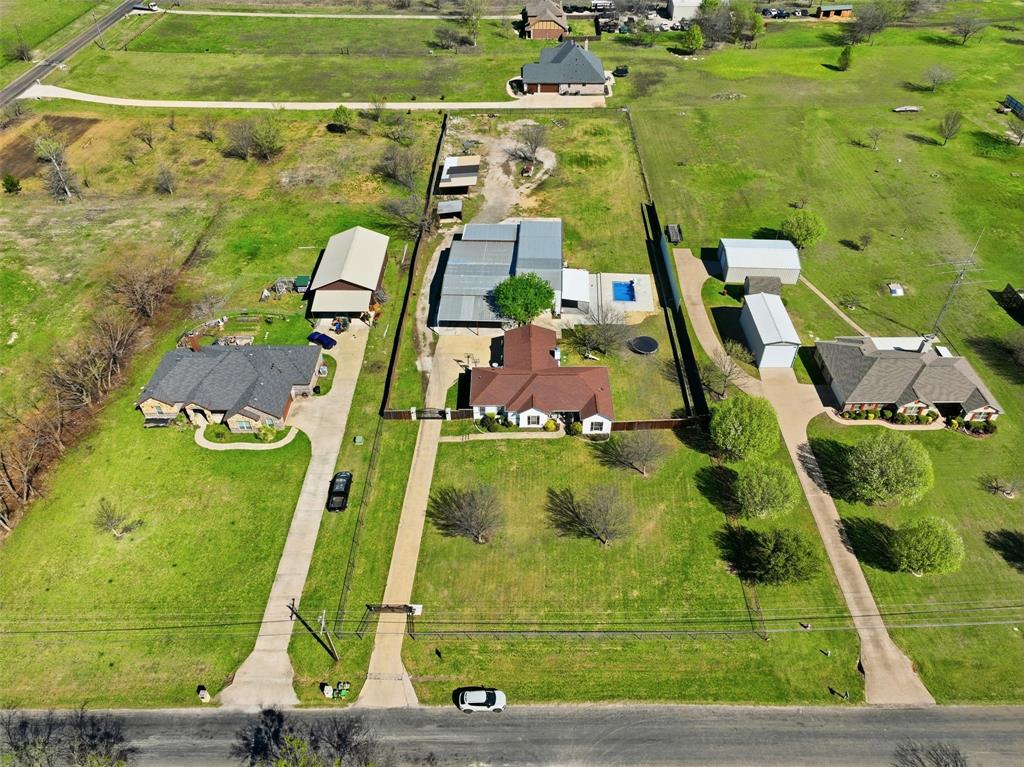 113 Mulkey Road Waxahachie, TX 75167 - Photo 36 of 39 an aerial view of a pool with a yard