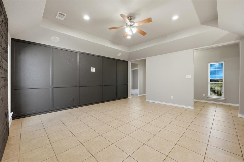 113 Mulkey Road Waxahachie, TX 75167 - Photo 5 of 39 a view of an empty room and a ceiling fan