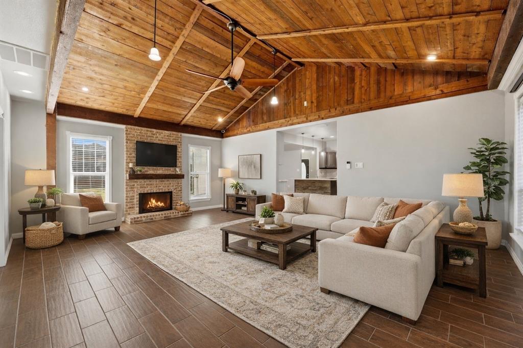113 Mulkey Road Waxahachie, TX 75167 - Photo 10 of 39 a living room with furniture and a flat screen tv