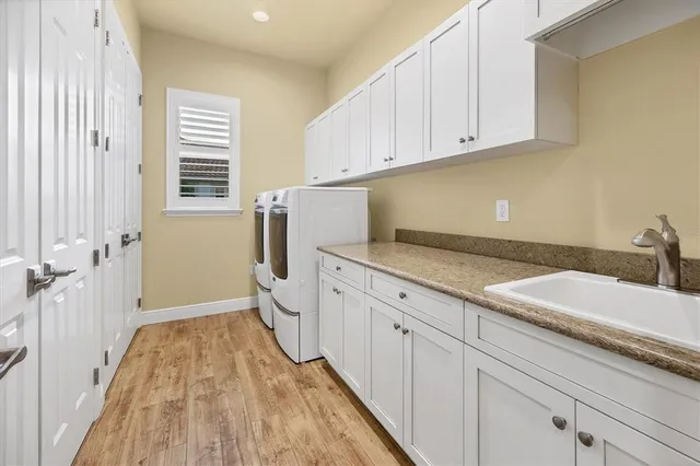 a spacious bathroom with a sink a toilet and a window