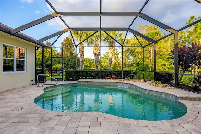a view of a patio with a table and chairs