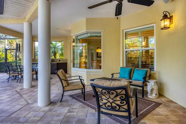 a view of a dining room with furniture window and outside view