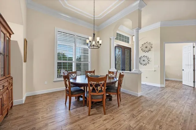 a view of a dining room with furniture window and wooden floor