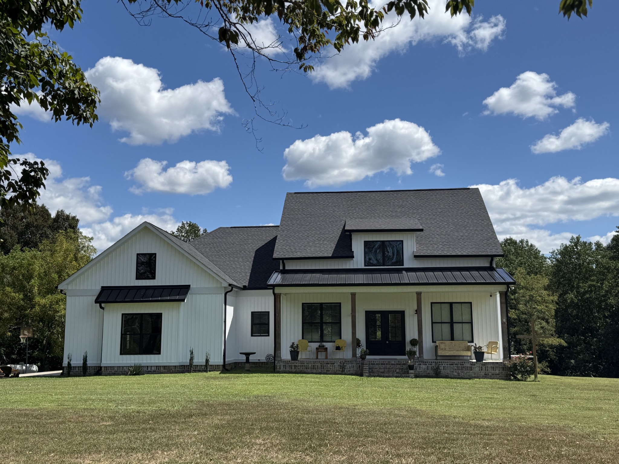 a front view of a house with garden