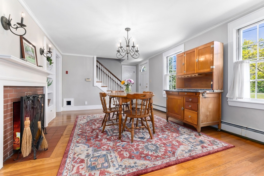 94 Conant Street Danvers, MA 01923 - Photo 14 of 36 a living room with furniture and a fireplace