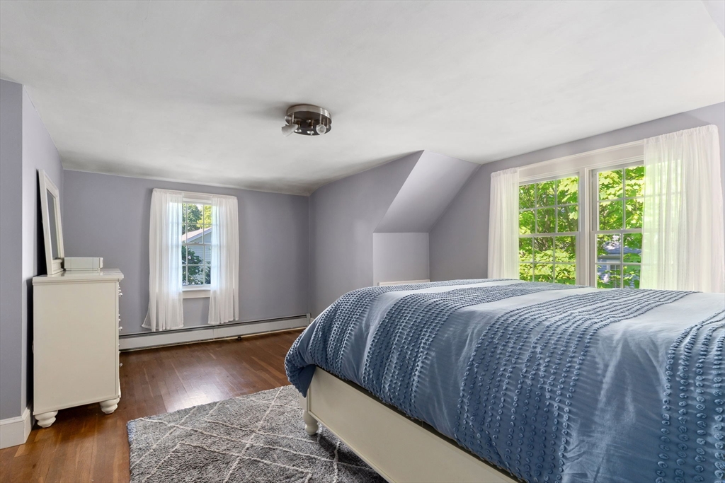 94 Conant Street Danvers, MA 01923 - Photo 25 of 36 a bedroom with a bed and a large window