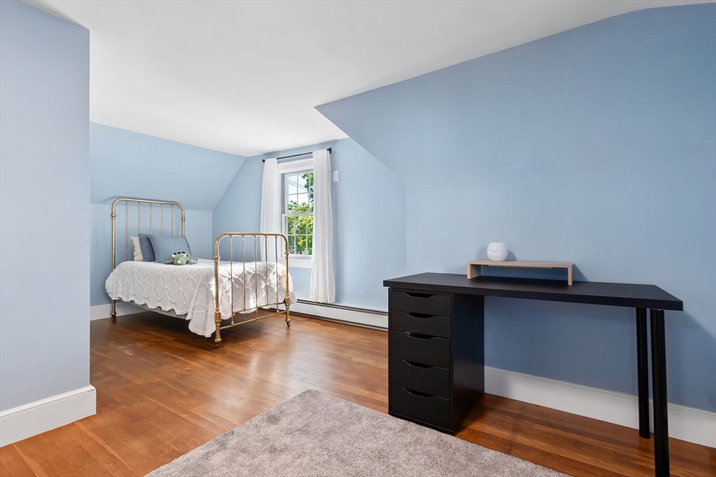 94 Conant Street Danvers, MA 01923 - Photo 29 of 36 a bedroom with a bed and a window