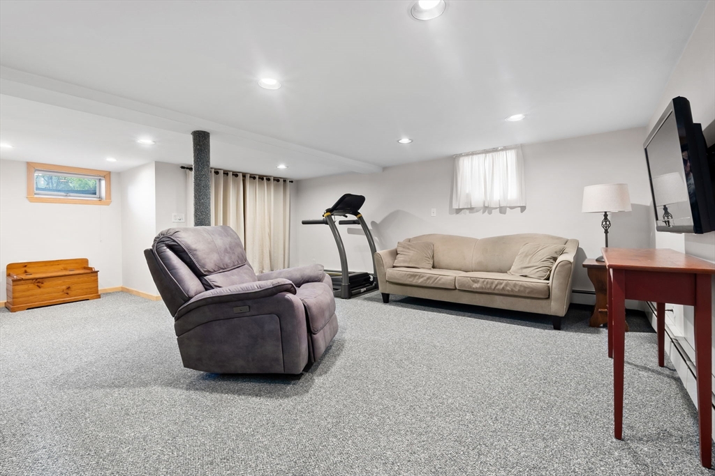94 Conant Street Danvers, MA 01923 - Photo 32 of 36 a living room with furniture and a flat screen tv