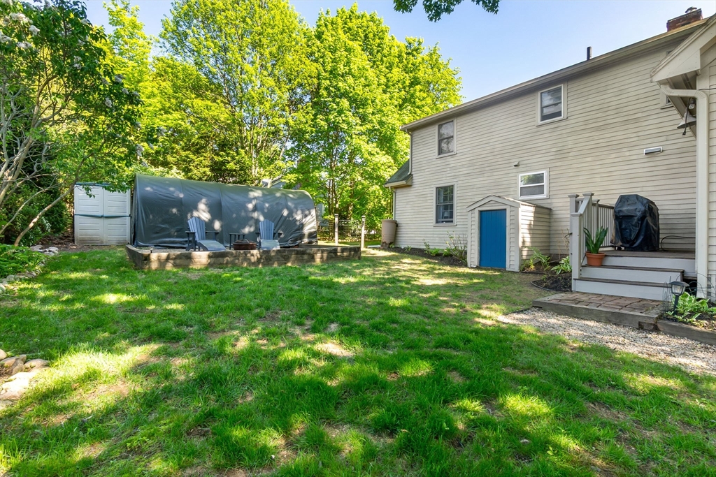 94 Conant Street Danvers, MA 01923 - Photo 34 of 36 a view of a house with a backyard and a patio