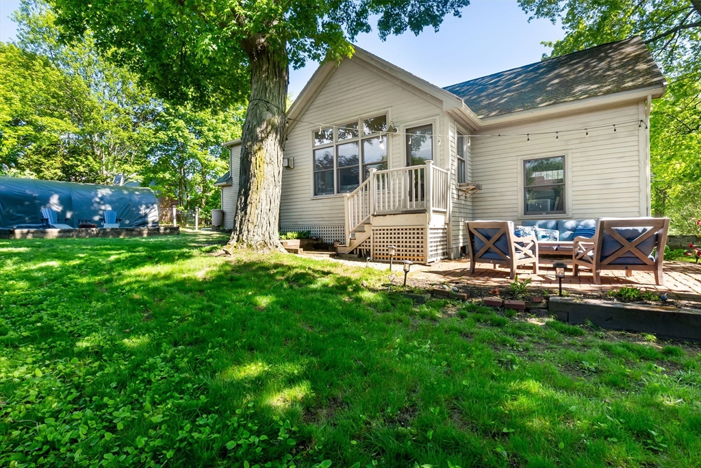 94 Conant Street Danvers, MA 01923 - Photo 35 of 36 a front view of house with yard and green space