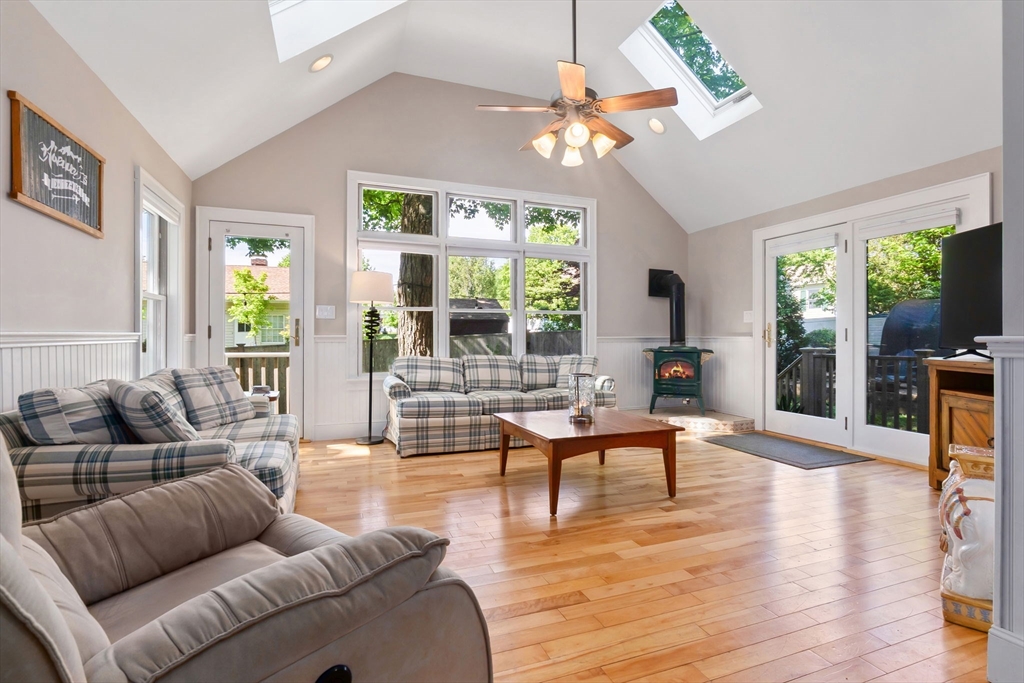 94 Conant Street Danvers, MA 01923 - Photo 5 of 36 a living room with furniture a large window and a dining table