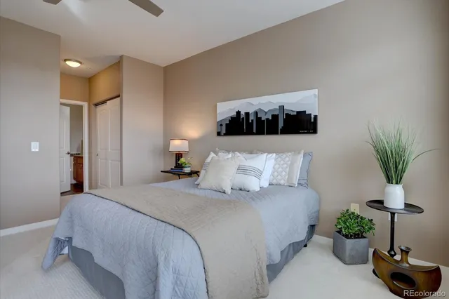 a bedroom with bed and a couch