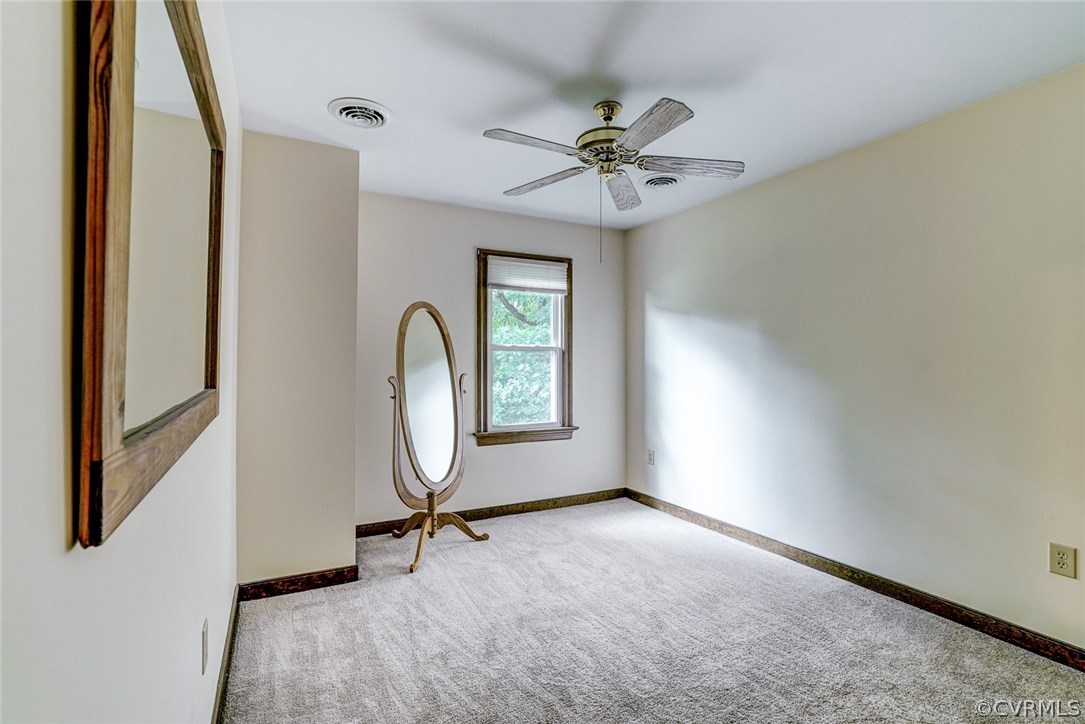 6100 Springwood Road Chester, VA 23831 - Photo 17 of 25 a view of an empty room with a window
