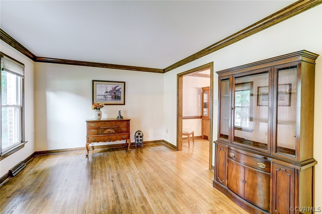 6100 Springwood Road Chester, VA 23831 - Photo 3 of 25 a living room with furniture stove and wooden floor