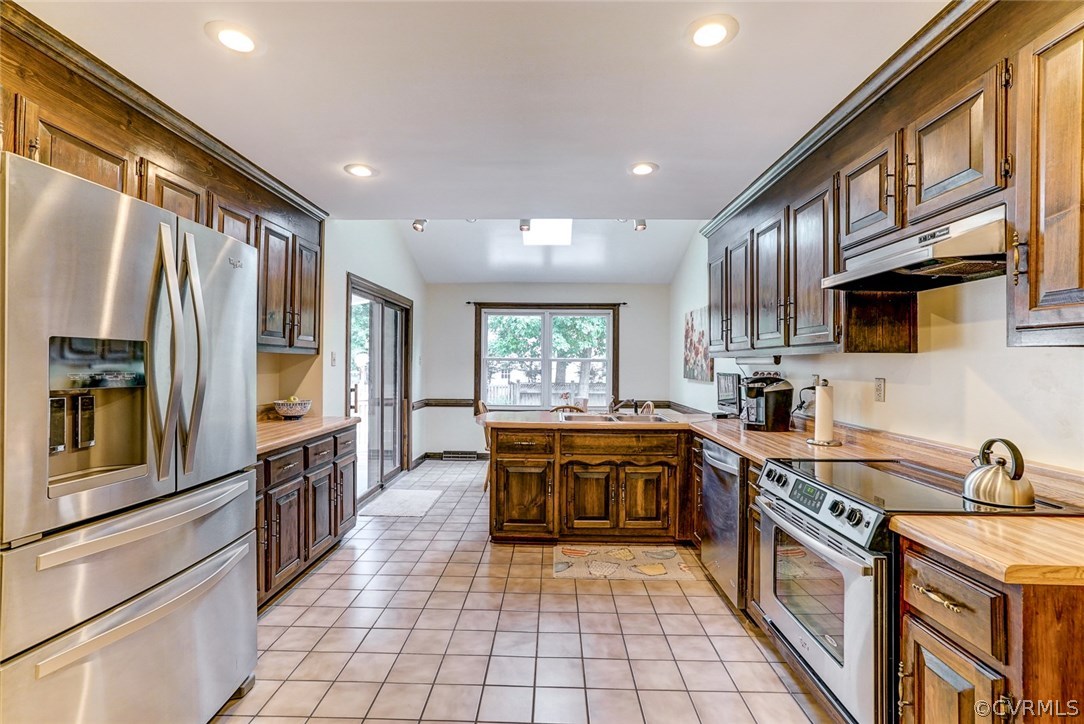 6100 Springwood Road Chester, VA 23831 - Photo 5 of 25 a large kitchen with stainless steel appliances granite countertop a stove refrigerator and cabinets