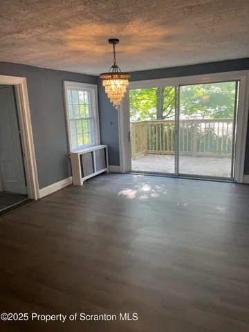 a view of a livingroom with wooden floor